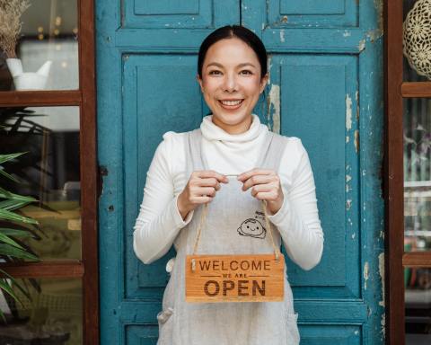 Photo by Ketut Subiyanto: https://www.pexels.com/photo/ethnic-female-cafe-owner-showing-welcome-we-are-open-inscription-4473398/